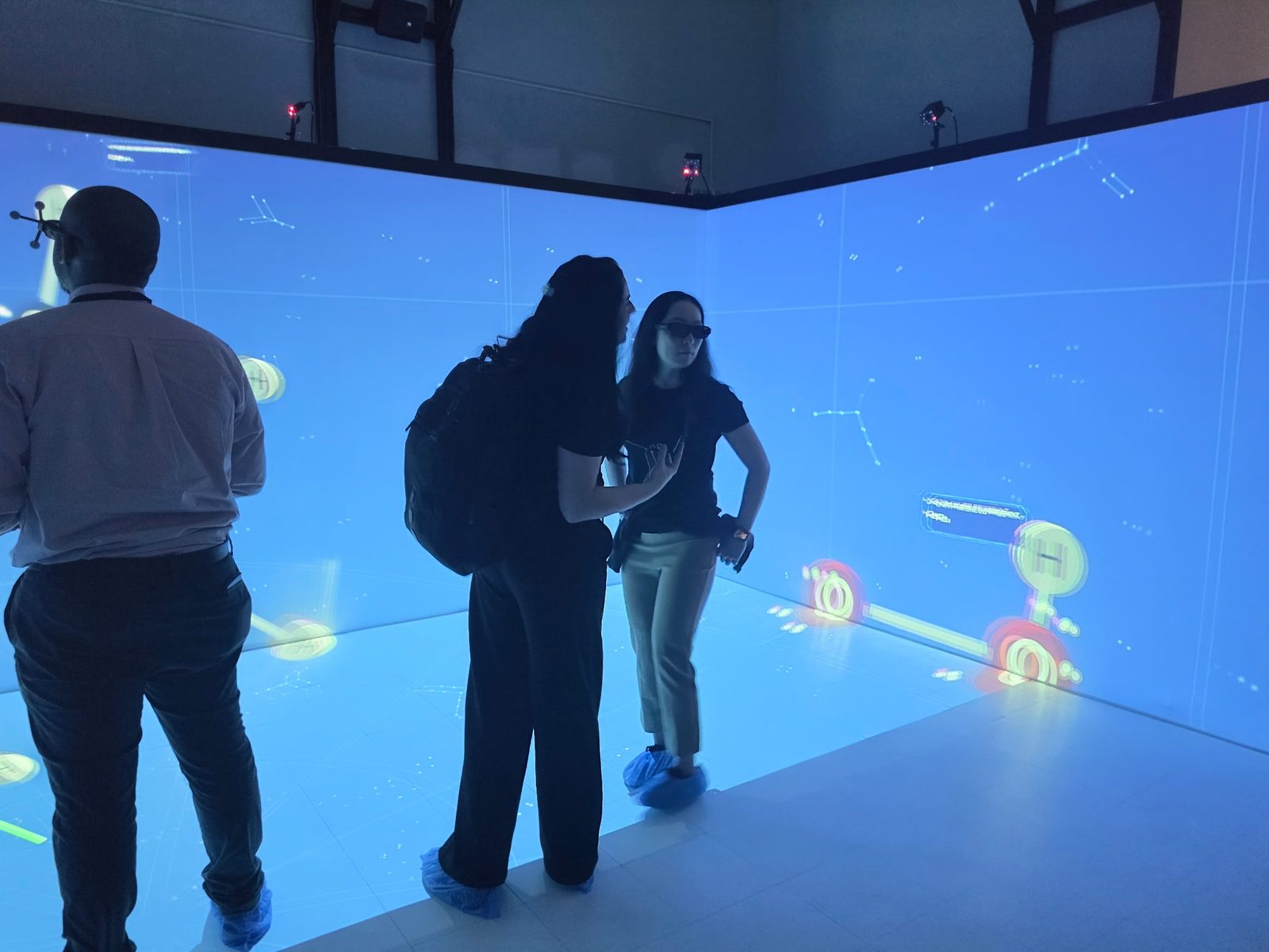 Visitors standing in the stationary CAVE