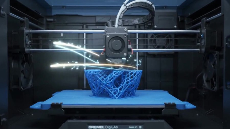 A desktop 3D printer building a part