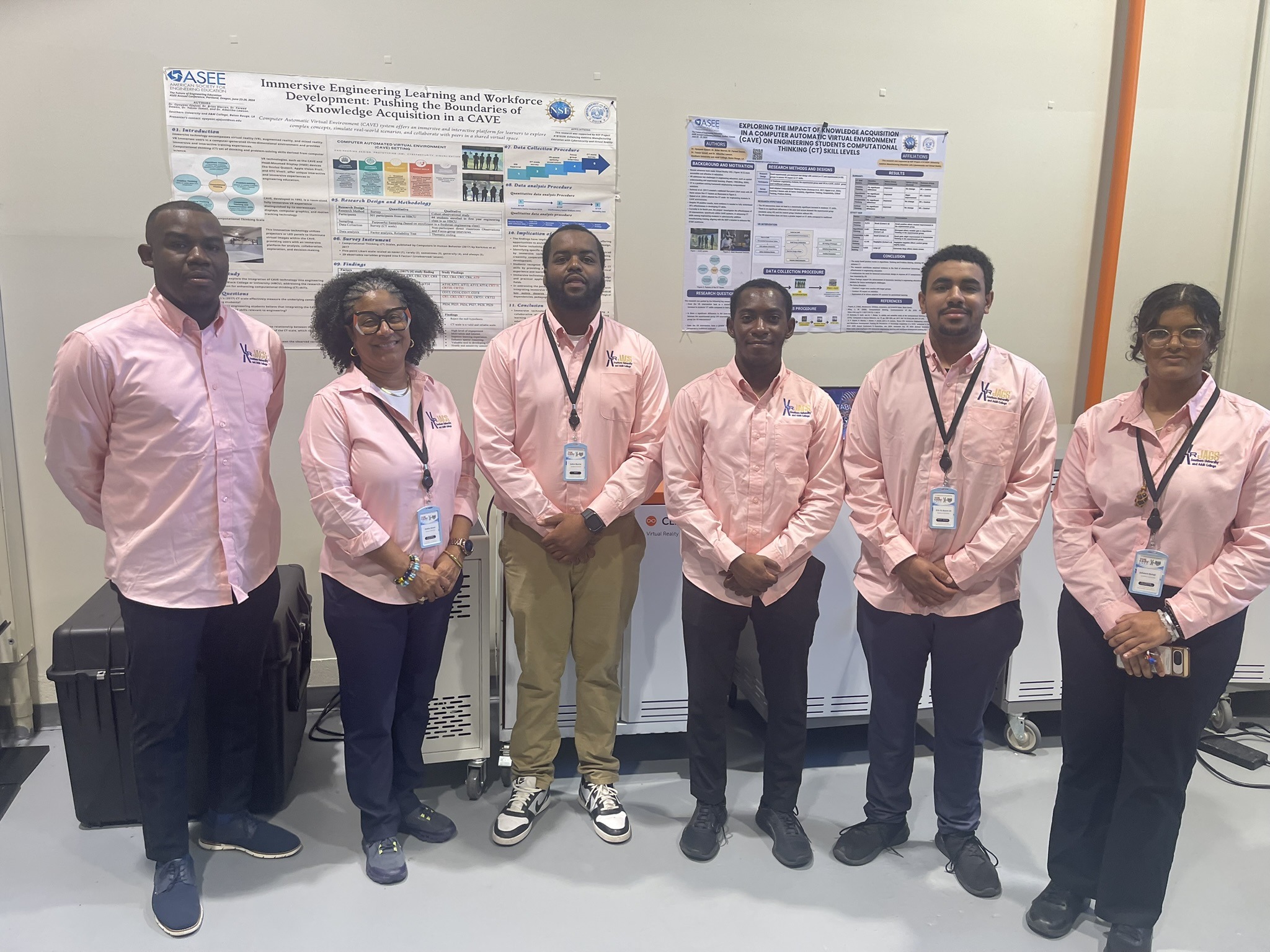 Six XR JAGS team members standing in front of the CAVE research posters